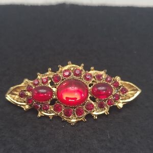 Elegant Gold and Red Gem Brooch